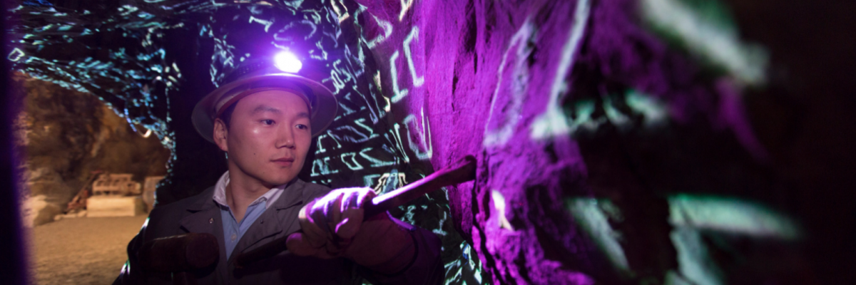 Environmental portraits of Jaewoo Lee 'data mining' in a gold mine.